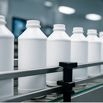 Filling line close-up with HDPE bottles